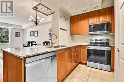 Wood cabinetry and stone counters - 