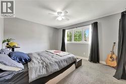 Bedroom with carpet floors and ceiling fan - 