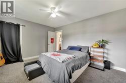 Bedroom with carpet and a ceiling fan - 