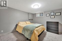 Carpeted bedroom featuring baseboards - 