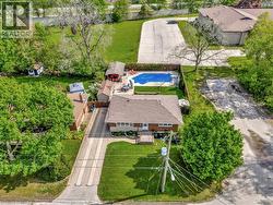 Aerial view of residential area featuring a pool area - 