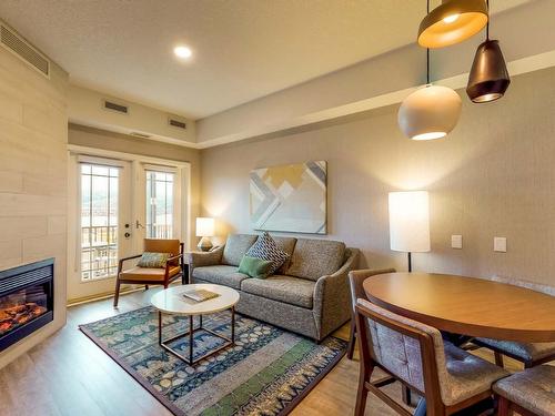 311Abcd-1200 Rancher Creek Road, Osoyoos, BC - Indoor Photo Showing Living Room With Fireplace