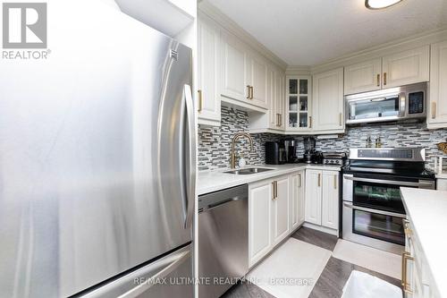 1007 - 530 Lolita Garden, Mississauga, ON - Indoor Photo Showing Kitchen With Stainless Steel Kitchen With Double Sink