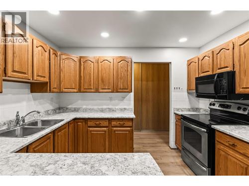 2110 Hoy Street Unit# 306, Kelowna, BC - Indoor Photo Showing Kitchen With Double Sink