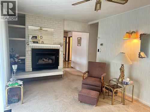 8267 Riverside Drive, Grand Forks, BC - Indoor Photo Showing Living Room With Fireplace