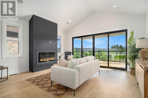 2 - 29 Whittlers Cove Lane, Rideau Lakes, ON - Indoor Photo Showing Living Room With Fireplace