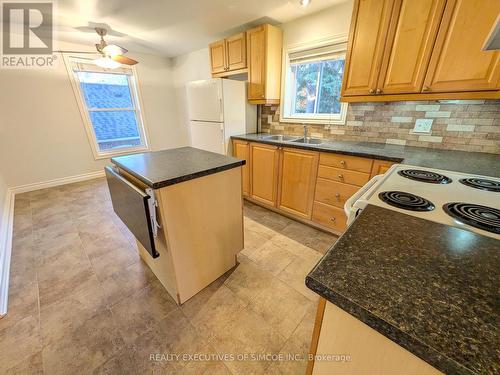 Kitchen with centre island Upper unit - 127 Innisfil Street, Barrie, ON - Indoor Photo Showing Kitchen With Double Sink