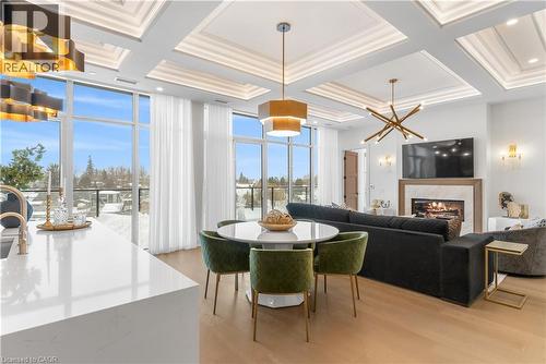 6523 Wellington 7 Road Unit# 509, Elora, ON - Indoor Photo Showing Dining Room With Fireplace