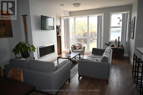 207 - 130 Water Street, Gananoque, ON - Indoor Photo Showing Living Room With Fireplace