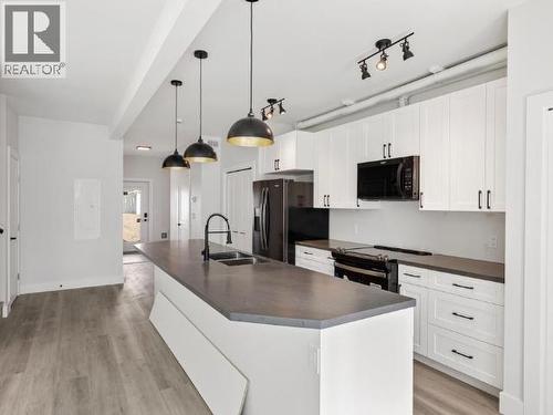 175 Witch Hazel Drive, Whitehorse, YT - Indoor Photo Showing Kitchen With Double Sink With Upgraded Kitchen