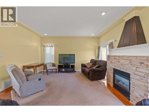 6785 Foothills Drive, Vernon, BC - Indoor Photo Showing Living Room With Fireplace