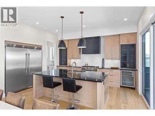 Designer kitchen with large island. - 4964 Bucktail Lane, Kelowna, BC - Indoor Photo Showing Kitchen With Upgraded Kitchen