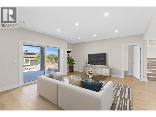 Lower level rec room - Virtually staged - 4964 Bucktail Lane, Kelowna, BC - Indoor Photo Showing Living Room