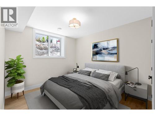 Lower level bedroom 2 - Virtually staged. - 4964 Bucktail Lane, Kelowna, BC - Indoor Photo Showing Bedroom