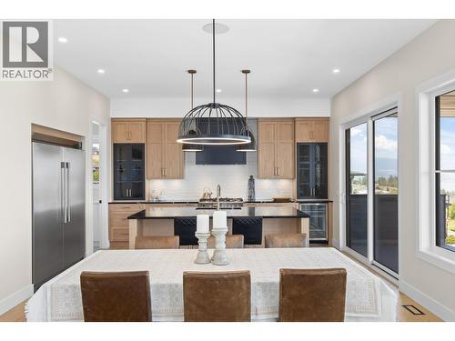 Open style living, dining and kitchen. - 4964 Bucktail Lane, Kelowna, BC - Indoor