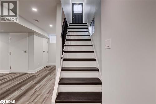 Stairway featuring wood finished floors and recessed lighting - 22 St James Street Unit# C, Brantford, ON - Indoor Photo Showing Other Room