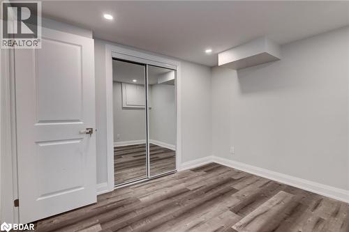 Unfurnished bedroom featuring wood finished floors, a closet, and recessed lighting - 22 St James Street Unit# C, Brantford, ON - Indoor Photo Showing Other Room