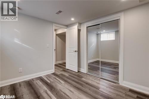Unfurnished bedroom featuring light wood-style floors, recessed lighting, and a closet - 22 St James Street Unit# C, Brantford, ON - Indoor Photo Showing Other Room