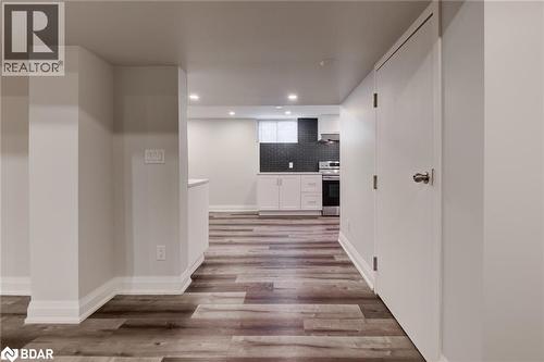 Corridor with light wood-style floors and recessed lighting - 22 St James Street Unit# C, Brantford, ON - Indoor Photo Showing Other Room