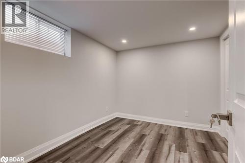 Below grade area with wood finished floors and recessed lighting - 22 St James Street Unit# C, Brantford, ON - Indoor Photo Showing Other Room
