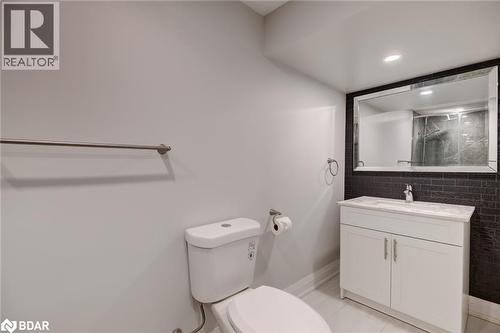 Full bathroom with light tile patterned flooring, vanity, a shower stall, recessed lighting, and tasteful backsplash - 22 St James Street Unit# C, Brantford, ON - Indoor Photo Showing Bathroom