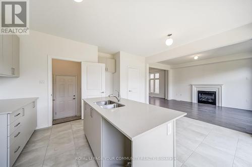 22 Sam Battaglia Crescent, Georgina, ON - Indoor Photo Showing Kitchen With Fireplace With Double Sink