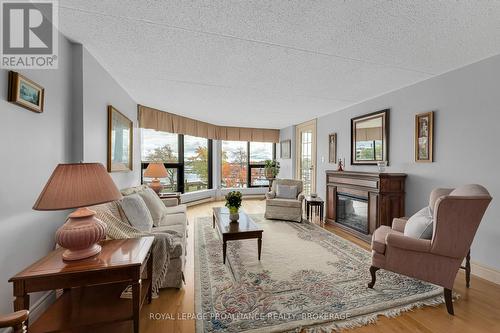 302 - 50 Market Street, Gananoque, ON - Indoor Photo Showing Living Room With Fireplace
