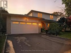 Twilight image showing wide double Driveway - 