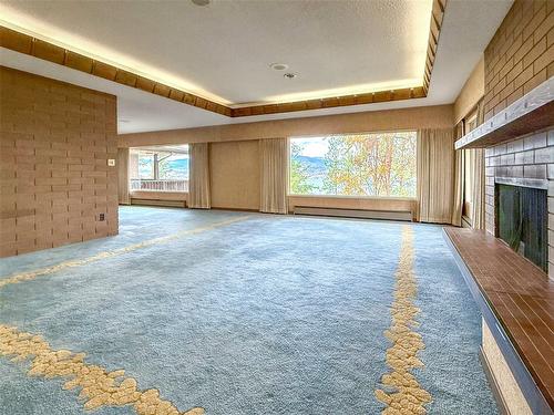5090 Ash Road, Kelowna, BC - Indoor Photo Showing Other Room With Fireplace
