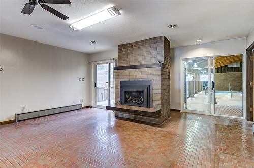 5090 Ash Road, Kelowna, BC - Indoor Photo Showing Living Room With Fireplace