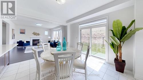 62 Frank Kelly Drive, East Gwillimbury, ON - Indoor Photo Showing Dining Room With Fireplace