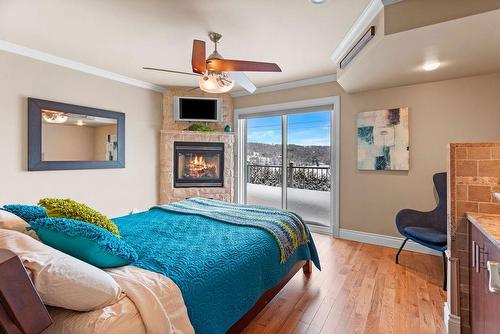 Primary bedroom - 48  - 48A Rue Des Trembles, Sainte-Marguerite-Du-Lac-Masson, QC - Indoor Photo Showing Bedroom With Fireplace