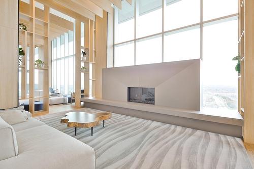 Salle communautaire - 2010-60 Rue De L'Éclipse, Brossard, QC - Indoor Photo Showing Living Room With Fireplace