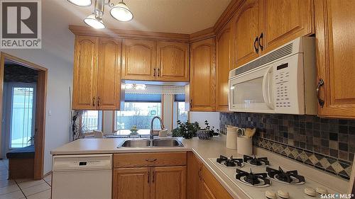 210 3Rd Street E, Vanscoy, SK - Indoor Photo Showing Kitchen With Double Sink
