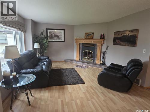 218 Ruby Drive, Coteau Rm No. 255, SK - Indoor Photo Showing Living Room With Fireplace