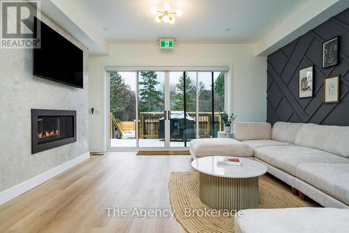 1,2,3 - 145 Kandahar Lane, Blue Mountains, ON - Indoor Photo Showing Living Room With Fireplace