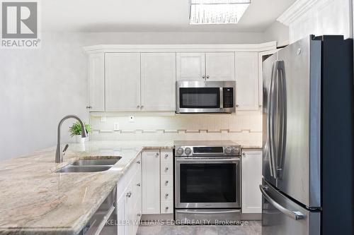 201 - 4013 Kilmer Drive, Burlington, ON - Indoor Photo Showing Kitchen With Stainless Steel Kitchen With Double Sink