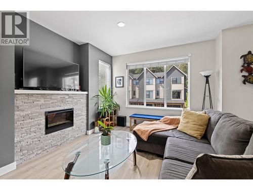 2490 Tuscany Drive Unit# 61, West Kelowna, BC - Indoor Photo Showing Living Room With Fireplace