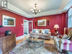 French doors opening to a coffered living room - 