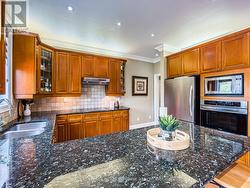 Spacious eat-in kitchen with granite countertops - 