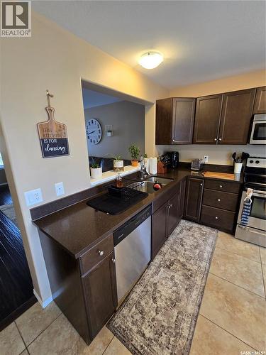 6 815 5Th Street Ne, Weyburn, SK - Indoor Photo Showing Kitchen With Stainless Steel Kitchen With Double Sink