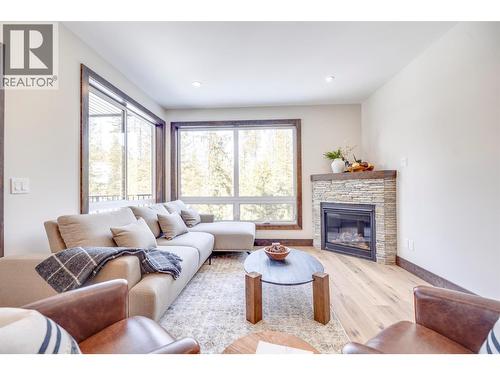 4576 Timberline Crescent Unit# 38, Fernie, BC - Indoor Photo Showing Living Room With Fireplace