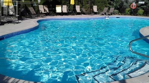 96 - 5480 Glen Erin Drive, Mississauga, ON - Outdoor With In Ground Pool
