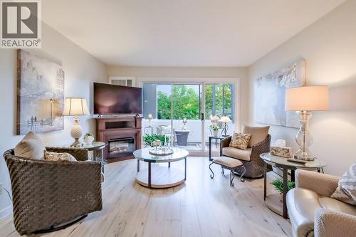 1170 Brookside Avenue Unit# 209, Kelowna, BC - Indoor Photo Showing Living Room With Fireplace