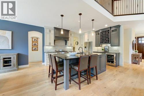 Sit-up island...perfect for breakfast or dinner! - 425 Audubon Court, Kelowna, BC - Indoor Photo Showing Kitchen With Upgraded Kitchen