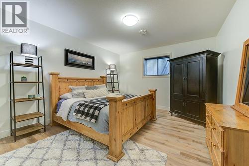 Lower level 5th Bedroom - 425 Audubon Court, Kelowna, BC - Indoor Photo Showing Bedroom