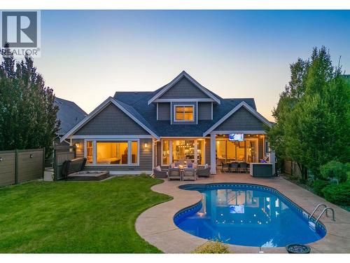 Walk from your main level right out to your amazing backyard ...watch the kids play from your kitchen! - 425 Audubon Court, Kelowna, BC - Outdoor With In Ground Pool With Deck Patio Veranda