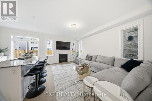 617 Etheridge Avenue, Milton, ON - Indoor Photo Showing Living Room With Fireplace