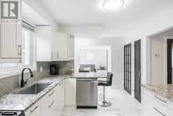 Kitchen window overlooks your Backyard. - 