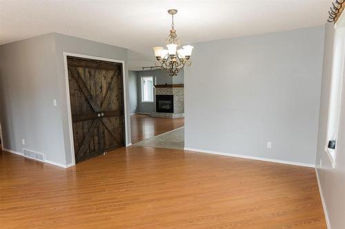 250 2Nd Avenue Nw, Carman, MB - Indoor Photo Showing Other Room With Fireplace